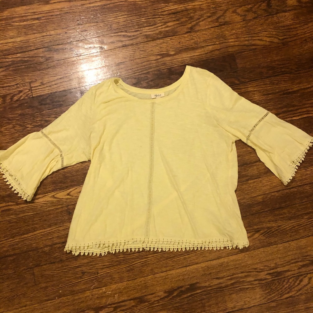Bright yellow 3/4 sleeve shirt.